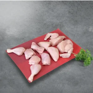 Haritha Hari Pre cut chicken skinless on a red plate